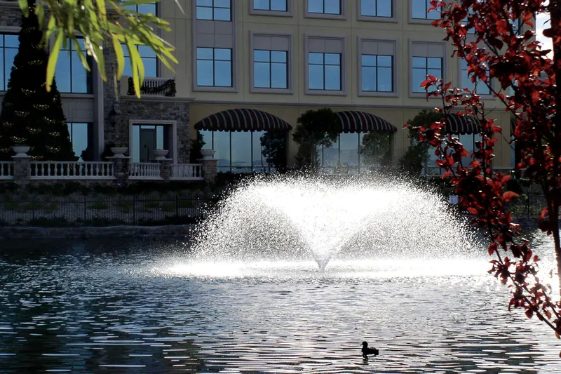 Otterbine Sunburst aerating fountain spraying on a lake